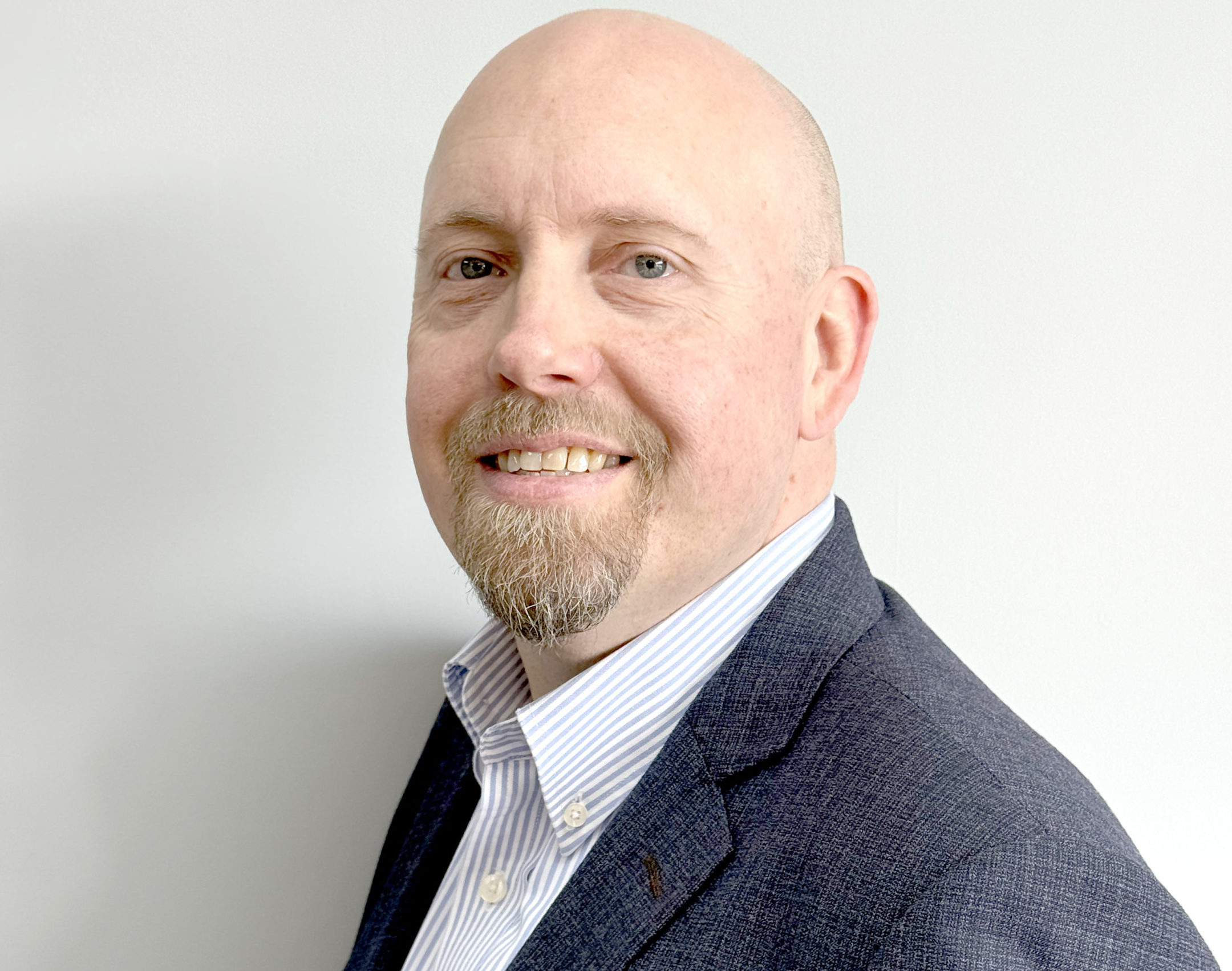 A commercial headshot of Director of Growth
