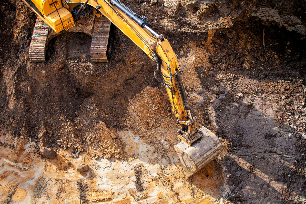 Image shows digger to illustrate the idea of burying contaminated land as part of ATG Group's Don't Bury The Problem campaign